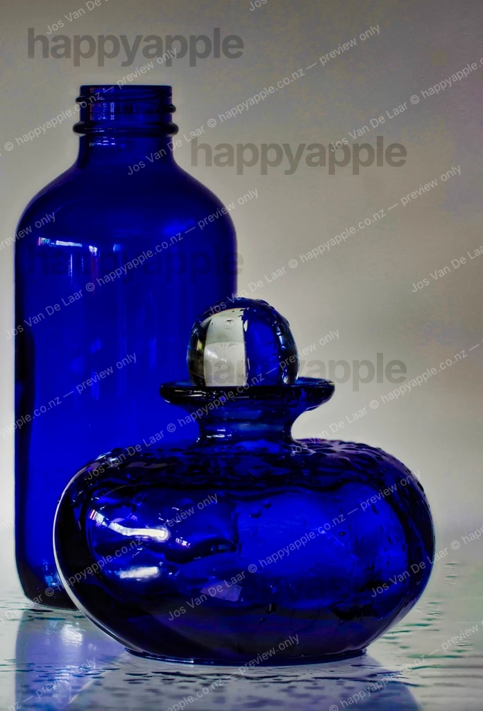Two Cobalt Blue Glass Vessels — Bottle and Perfume Decanter — Abstract photo by Jos Van De Laar