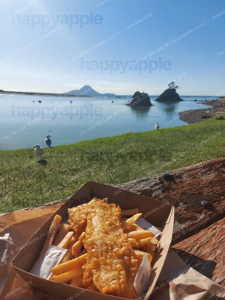 Fish and Chips by the Bay with Volcanic Island Views — Landscape photo by Jos Van De Laar
