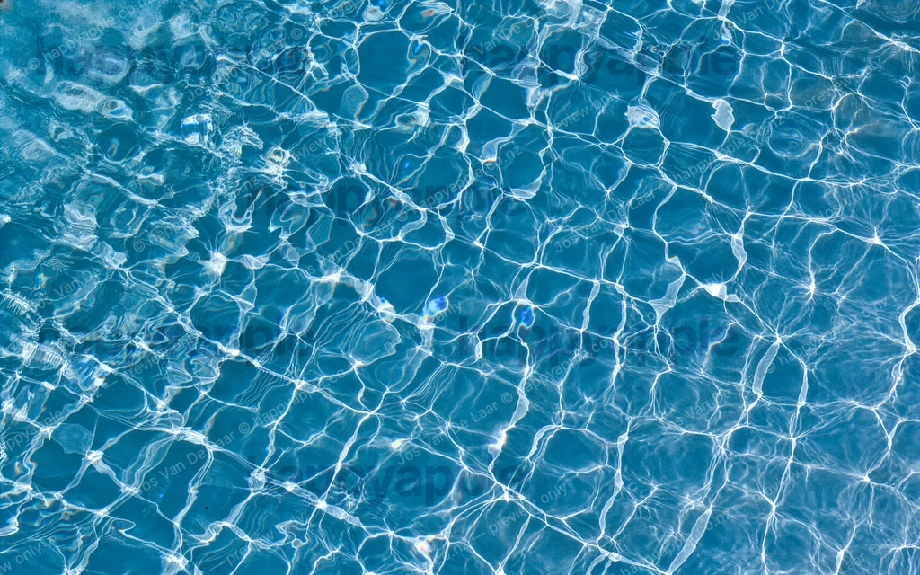 Shimmering Pool Water Surface with Caustic Light Patterns — Abstract photo by Jos Van De Laar