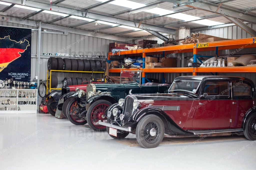 Collection of vintage cars parked inside a storage garage — Automotive photo by Jeff Van de Laar