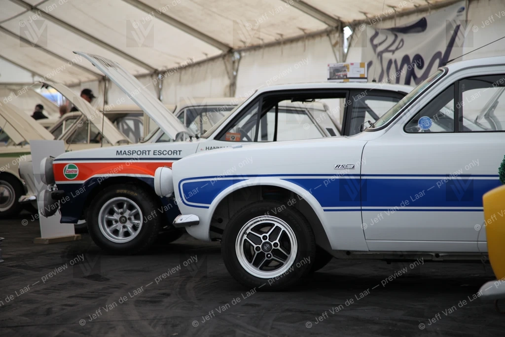 Classic rally cars on display under a marquee tent — Automotive photo by Jeff Van de Laar